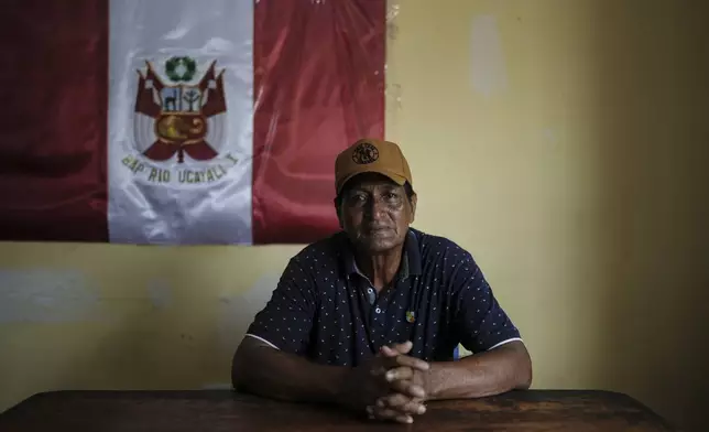 Mayor Max Ortiz poses for a portrait in his office in Santa Rosa, Peru, an island on the Amazon River at the center of a territorial dispute with Colombia, Saturday, Aug. 16, 2025. (AP Photo/Ivan Valencia)