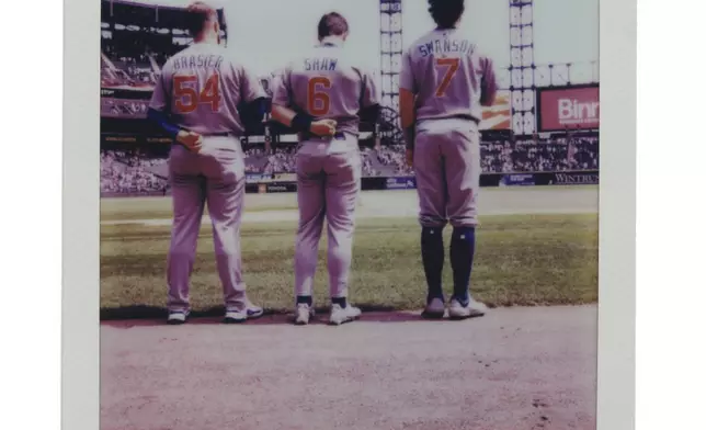 Players stand for the Star-Spangled Banner during a Chicago Cubs versus Chicago White Sox Crosstown Classic series baseball game Sunday, July 27, 2025, in Chicago. (AP Photo/Erin Hooley)