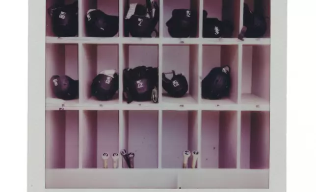 Helmets and bats are kept in a dugout during a Chicago Cubs versus Chicago White Sox Crosstown Classic series baseball game Sunday, July 27, 2025, in Chicago. (AP Photo/Erin Hooley)