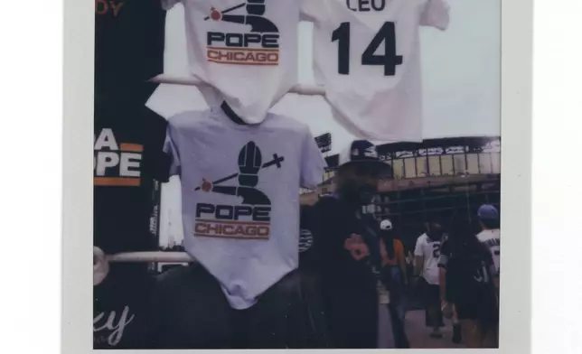 Pope Leo XIV-themed shirts are for sale before a Chicago Cubs versus Chicago White Sox Crosstown Classic series baseball game Saturday, July 26, 2025, in Chicago. (AP Photo/Erin Hooley)