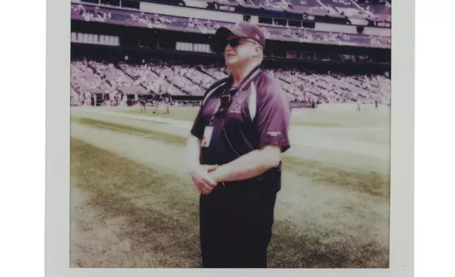 Veteran security guard Tom Dermody watches fans during a Chicago Cubs versus Chicago White Sox Crosstown Classic series baseball game Sunday, July 27, 2025, in Chicago. (AP Photo/Erin Hooley)