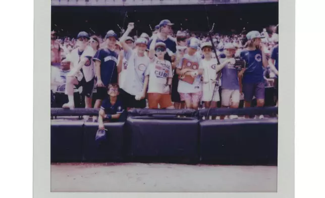 Young fans wait for players before a Chicago Cubs versus Chicago White Sox Crosstown Classic series baseball game Sunday, July 27, 2025, in Chicago. (AP Photo/Erin Hooley)