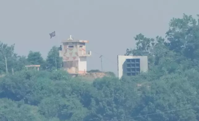FILE - A North Korean military guard post, left, and loudspeaker are seen from Paju, South Korea, near the border with North Korea, June 12, 2025. (AP Photo/Ahn Young-joon, File)