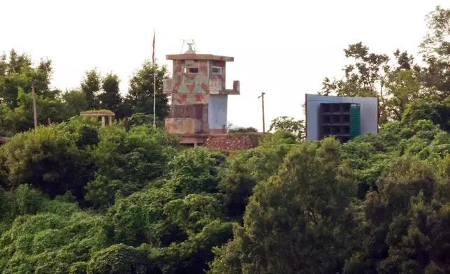 A North Korean military guard post, left, and loudspeaker are seen from Paju, South Korea, near the border with North Korea, Saturday, Aug. 9, 2025. (Kim In-chul/Yonhap via AP)