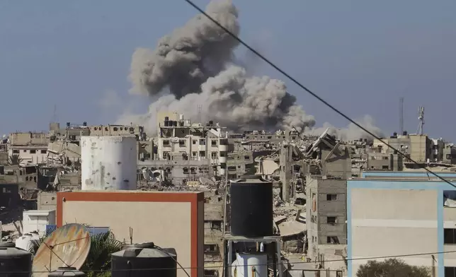 Smoke rises to the sky following an Israeli army airstrike in Khan Younis, in the Gaza Strip, Monday, Aug. 18, 2025. (AP Photo/Mariam Dagga)