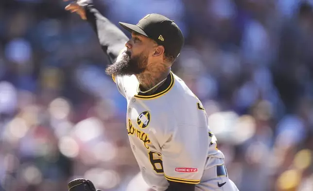 Pittsburgh Pirates relief pitcher Dennis Santana works against the Colorado Rockies in the ninth inning of a baseball game Sunday, Aug. 3, 2025, in Denver. (AP Photo/David Zalubowski)