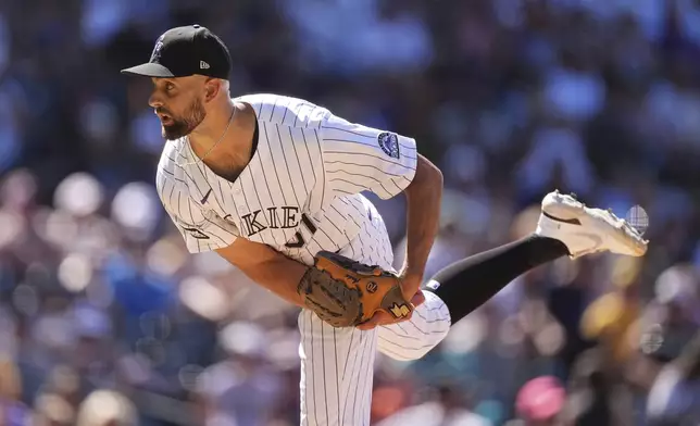 Colorado Rockies relief pitcher Nick Anderson works against the Pittsburgh Pirates in the ninth inning of a baseball game Sunday, Aug. 3, 2025, in Denver. (AP Photo/David Zalubowski)