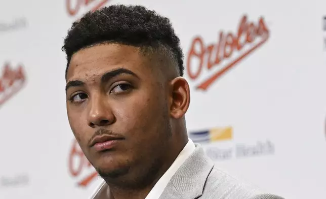 Baltimore Orioles' Samuel Basallo looks on during a press conference after signing a contract extension Saturday, Aug. 23, 2025, in Baltimore. (AP Photo/Terrance Williams)