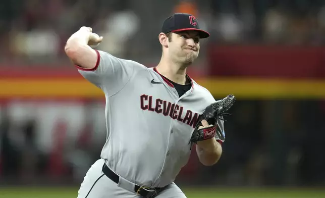 Cleveland Guardians starting pitcher Gavin Williams throws against the Arizona Diamondbacks during the first inning of a baseball game Monday, Aug. 18, 2025, in Phoenix. (AP Photo/Ross D. Franklin)