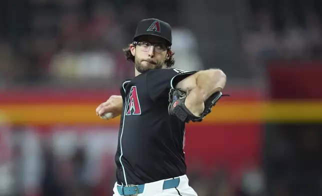 Arizona Diamondbacks starting pitcher Zac Gallen throws against the Cleveland Guardians during the first inning of a baseball game Monday, Aug. 18, 2025, in Phoenix. (AP Photo/Ross D. Franklin)