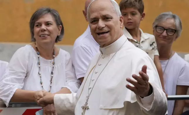 Pope Leo XIV is cheered by faithful as he arrives to celebrate a Mass at the Santa Maria della Rotonda Sanctuary in Albano Laziale, Sunday, Aug. 17, 2025. (AP Photo/Gregorio Borgia)