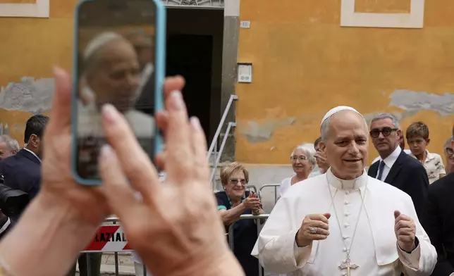 Pope Leo XIV is cheered by faithful as he arrives to celebrate a Mass at the Santa Maria della Rotonda Sanctuary in Albano Laziale, Sunday, Aug. 17, 2025. (AP Photo/Gregorio Borgia)