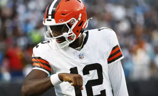 Cleveland Browns quarterback Shedeur Sanders celebrates after his first touchdown pass against the Carolina Panthers during the first half of a preseason NFL football game on Friday, Aug. 8, 2025, in Charlotte, N.C. (AP Photo/Rusty Jones)