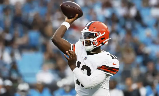 Cleveland Browns quarterback Shedeur Sanders throws his first touchdown pass during the first half of a preseason NFL football game against the Carolina Panthers on Friday, Aug. 8, 2025, in Charlotte, N.C. (AP Photo/Rusty Jones)