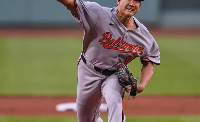 Baltimore Orioles pitcher Tomoyuki Sugano delivers in the first inning of a baseball game against the Boston Red Sox at Fenway Park, Tuesday, Aug. 19, 2025, in Boston. (AP Photo/Charles Krupa)
