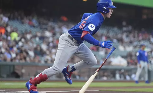 Chicago Cubs' Pete Crow-Armstrong runs to first base after hitting a single against the San Francisco Giants during the first inning of a baseball game in San Francisco, Tuesday, Aug. 26, 2025. (AP Photo/Jeff Chiu)
