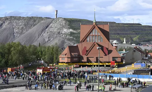 On a specially designed trolley with 224 wheels, Kiruna Church is being moved at a speed of half a kilometre per hour, in Kiruna, Sweden, Tuesday Aug. 19, 2025. (Fredrik Sandberg/TT News Agency via AP)