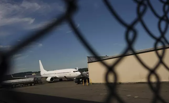 A U.S. Immigration and Customs Enforcement flight operates out of King County International Airport-Boeing Field, Saturday, Aug. 23, 2025, in Seattle. (AP Photo/Lindsey Wasson)