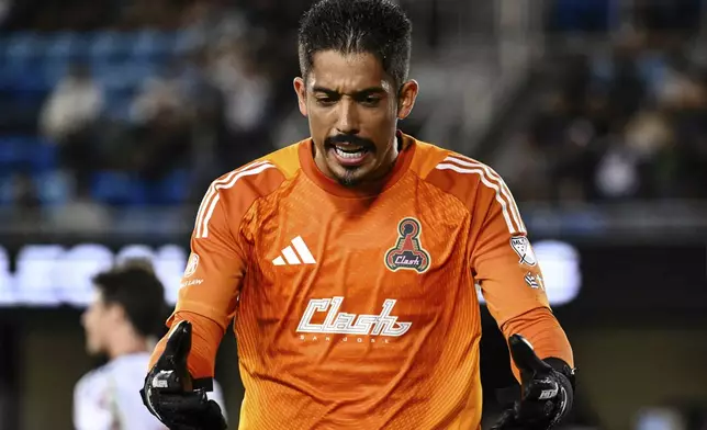 San Jose Earthquakes' Daniel (42) reacts after failing to save a goal scored by Vancouver Whitecaps' Brian White during the second half of an MLS soccer match Saturday, Aug. 9, 2025, in San Jose, Calif. (AP Photo/Thien-An Truong)