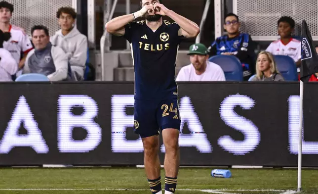 Vancouver Whitecaps' Brian White (24) reacts after scoring a goal against the San Jose Earthquakes during the second half of an MLS soccer match Saturday, Aug. 9, 2025, in San Jose, Calif. (AP Photo/Thien-An Truong)