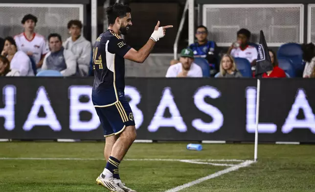 Vancouver Whitecaps' Brian White (24) reacts after scoring a goal against the San Jose Earthquakes during the second half of an MLS soccer match Saturday, Aug. 9, 2025, in San Jose, Calif. (AP Photo/Thien-An Truong)