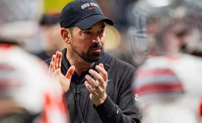 FILE - Ohio State head coach Ryan Day looks on before the College Football Playoff national championship game against Notre Dame, Jan. 20, 2025, in Atlanta. (AP Photo/Jacob Kupferman, File)