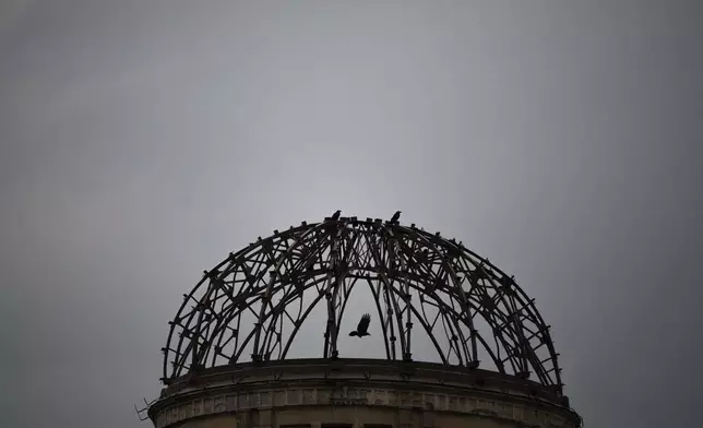 A bird flies past the Atomic Bomb Dome in Hiroshima, Monday, August 4, 2025 as Japan will mark 80th anniversary of the WWII U.S. atomic bombing on August 6. (AP Photo/Louise Delmotte)
