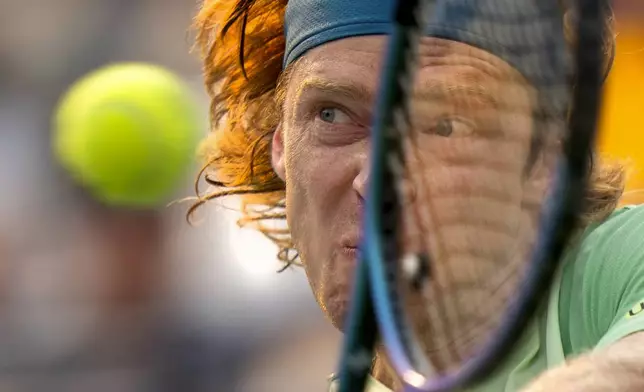 Andrey Rublev, of Russia, hits a backhand to Alejandro Davidovich Fokina, of Spain, during their match at the National Bank Open men's tennis tournament in Toronto, Sunday, Aug. 3, 2025. (Frank Gunn/The Canadian Press via AP)