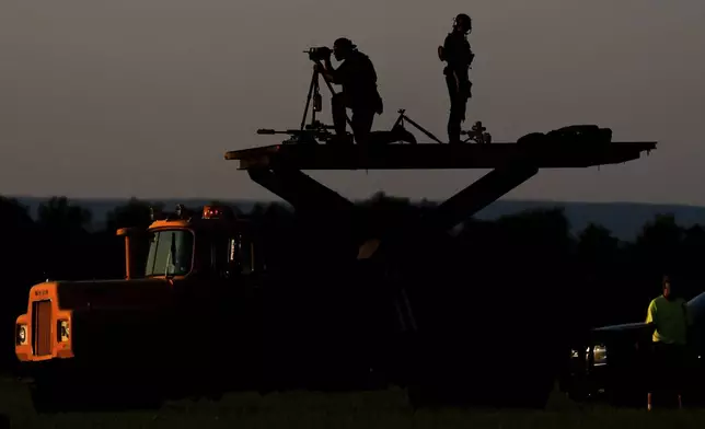 Secret Service agents stand watch at Lehigh Valley International Airport, Sunday, Aug. 3, 2025, in Allentown, Pa. (AP Photo/Julia Demaree Nikhinson)
