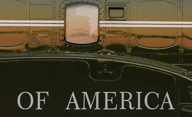 President Donald Trump is seen in the window of Marine One at Lehigh Valley International Airport, Sunday, Aug. 3, 2025, in Allentown, Pa. (AP Photo/Julia Demaree Nikhinson)