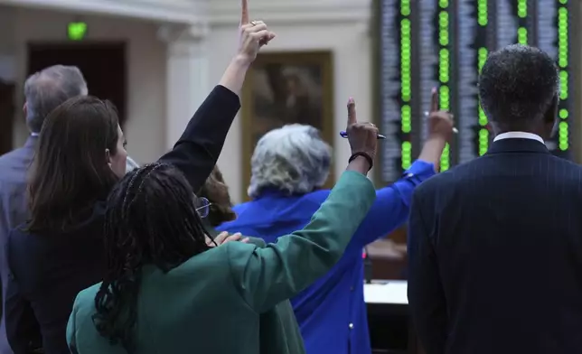 Texas state lawmakers vote on an amendment during debate over a redrawn U.S. congressional map in Texas during a special session, Wednesday, Aug. 20, 2025, in Austin, Texas. (AP Photo/Eric Gay)