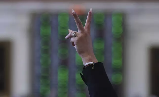 Democratic Texas state Rep. Cassandra Garcia Hernandez votes on a redrawn U.S. congressional map in Texas during a special session, Wednesday, Aug. 20, 2025, in Austin, Texas. (AP Photo/Eric Gay)