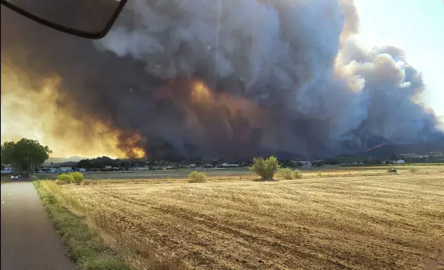 This photo provided by the Securite Civile shows the wildfire in the Corbieres massif, southern France, Tuesday, Aug. 5, 2025. (Securite Civile via AP)