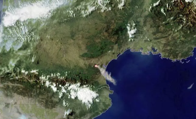 This photo provided by Meteo France shows smoke billowing from a wild fire in southern France, Tuesday, Aug. 5, 2025. (Meteo France via AP)