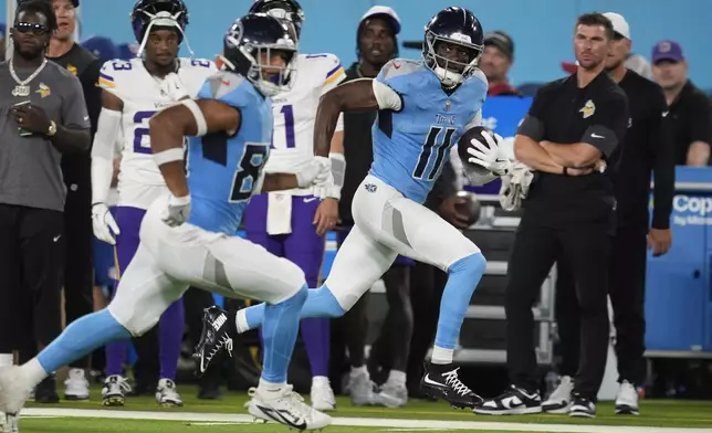 Tennessee Titans wide receiver Van Jefferson (11) runs for a touchdown after a catch against the Minnesota Vikings during the first half of a preseason NFL football game, Friday, Aug. 22, 2025, in Nashville, Tenn. (AP Photo/George Walker IV)