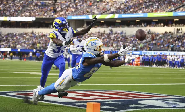 Los Angeles Chargers wide receiver KeAndre Lambert-Smith (84) cannot catch a pass in the end zone in front of Los Angeles Rams cornerback Cam Lampkin (33) during the first half of an NFL preseason football game, Saturday, Aug. 16, 2025, in Inglewood, Calif. (AP Photo/Jessie Alcheh)