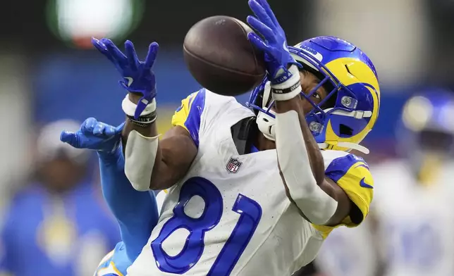 Los Angeles Rams wide receiver Brennan Presley (81) cannot catch a pass in front of Los Angeles Chargers cornerback Nikko Reed during the second half of an NFL preseason football game, Saturday, Aug. 16, 2025, in Inglewood, Calif. (AP Photo/Mark J. Terrill)