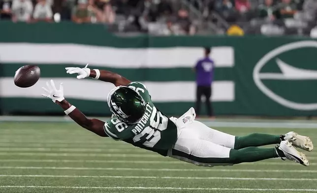 New York Jets wide receiver Jamaal Pritchett dives for a pass in the second half of a preseason NFL football game against the Philadelphia Eagles in East Rutherford, N.J., Friday, Aug. 22, 2025. (AP Photo/Yuki Iwamura)