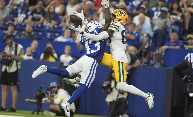 Indianapolis Colts safety Ladarius Tennison (43) breaks up a pass intended for Green Bay Packers wide receiver Isaiah Neyor (80) during the second half of a preseason NFL football game, Saturday, Aug. 16, 2025, in Indianapolis. (AP Photo/Michael Conroy)