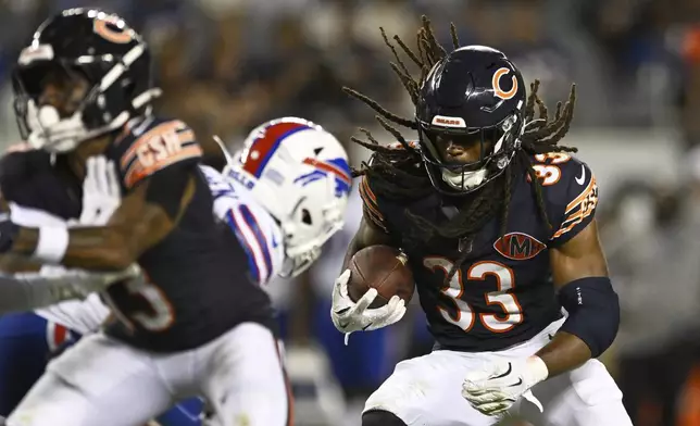 Chicago Bears running back Ian Wheeler (33) rushes for a touchdown in the second half of a preseason NFL football game against the Buffalo Bills Sunday, Aug. 17, 2025, in Chicago. (AP Photo/Paul Beaty)