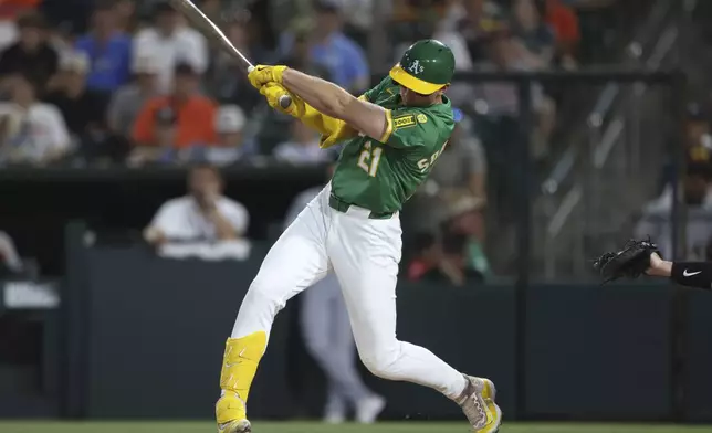 Athletics' Tyler Soderstrom hits an RBI single during the third inning of a baseball game against the Detroit Tigers, Tuesday, Aug. 26, 2025, in West Sacramento, Calif. (AP Photo/Scott Marshall)