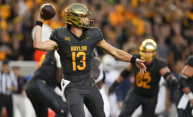 Baylor quarterback Sawyer Robertson throws a pass against Auburn during the first half of an NCAA college football game Friday, Aug. 29, 2025, in Waco, Texas. (AP Photo/Julio Cortez)