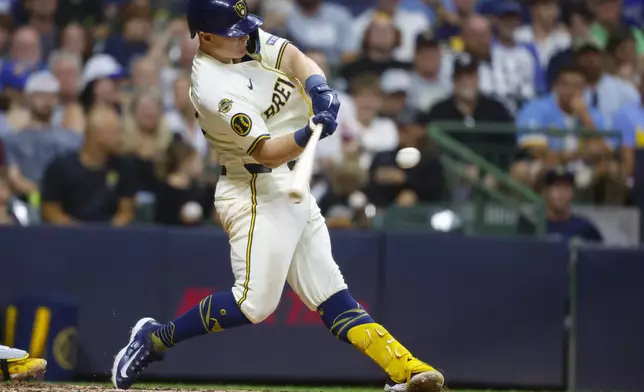 Milwaukee Brewers' Andrew Vaughn connects for a three-run home run against the Pittsburgh Pirates during the sixth inning of a baseball game, Tuesday, Aug.12, 2025, in Milwaukee. (AP Photo/Jeffrey Phelps)