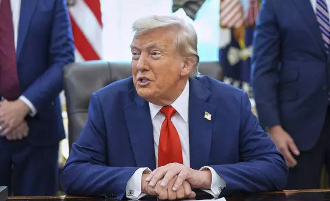 President Donald Trump speaks as he signs executive orders in the Oval Office of the White House, Monday, Aug. 25, 2025, in Washington. (AP Photo/Evan Vucci)