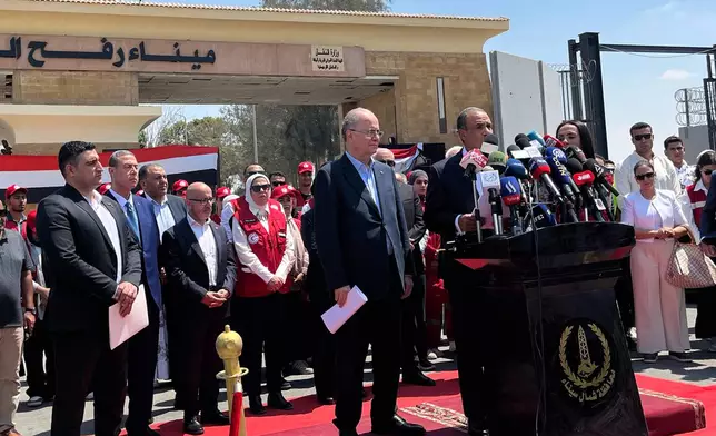 Palestinian Prime Minister Mohammed Mustafa, left on podium, and Egyptian Foreign Minister Badr Abdelatty, center on podium, attend a press conference during their visit to Rafah crossing between Egypt and the Gaza Strip, Monday, Aug. 18, 2025. (AP Photo/Mayar Mokhtar)