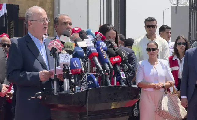 Palestinian Prime Minister Mohammed Mustafa, left on podium, and Egyptian Foreign Minister Badr Abdelatty, attend a press conference during their visit to Rafah crossing between Egypt and the Gaza Strip, Monday, Aug. 18, 2025. (AP Photo/Mohamed Arafat)