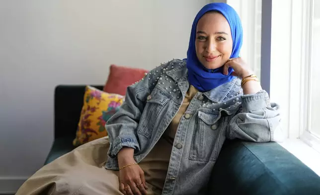 Hoda Abrahim, founder and CEO of Love, Inshallah, a matchmaker featured on the series "Muslim Matchmaker," on Hulu, appears in her home on Monday, Aug. 11, 2025, in Conroe, Texas. (AP Photo/Ashley Landis)