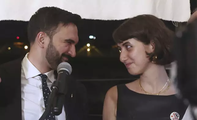 FILE - Democratic mayoral candidate Zohran Mamdani appears on stage with his wife, Rama Duwaji, right, at his primary election party, Wednesday, June 25, 2025, in New York. (AP Photo/Heather Khalifa, File)
