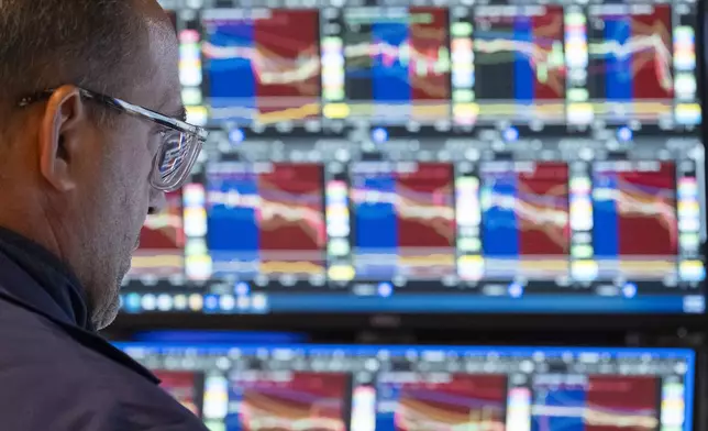 A Trader works on the floor of the New York Stock Exchange, Friday, Aug. 1, 2025, in New York. (AP Photo/Yuki Iwamura)