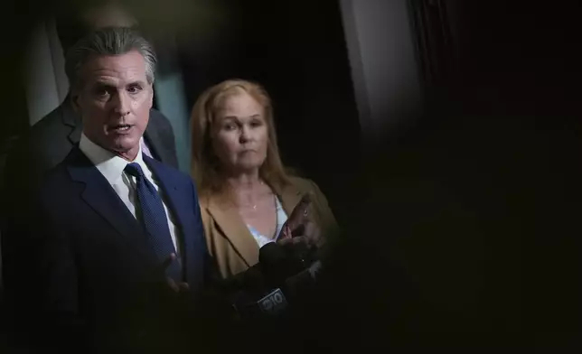 California Gov. Gavin Newsom answers questions after signing legislation calling for a special election on a redrawn congressional map on Thursday, Aug. 21, 2025, in Sacramento, Calif. (AP Photo/Godofredo A. Vásquez)